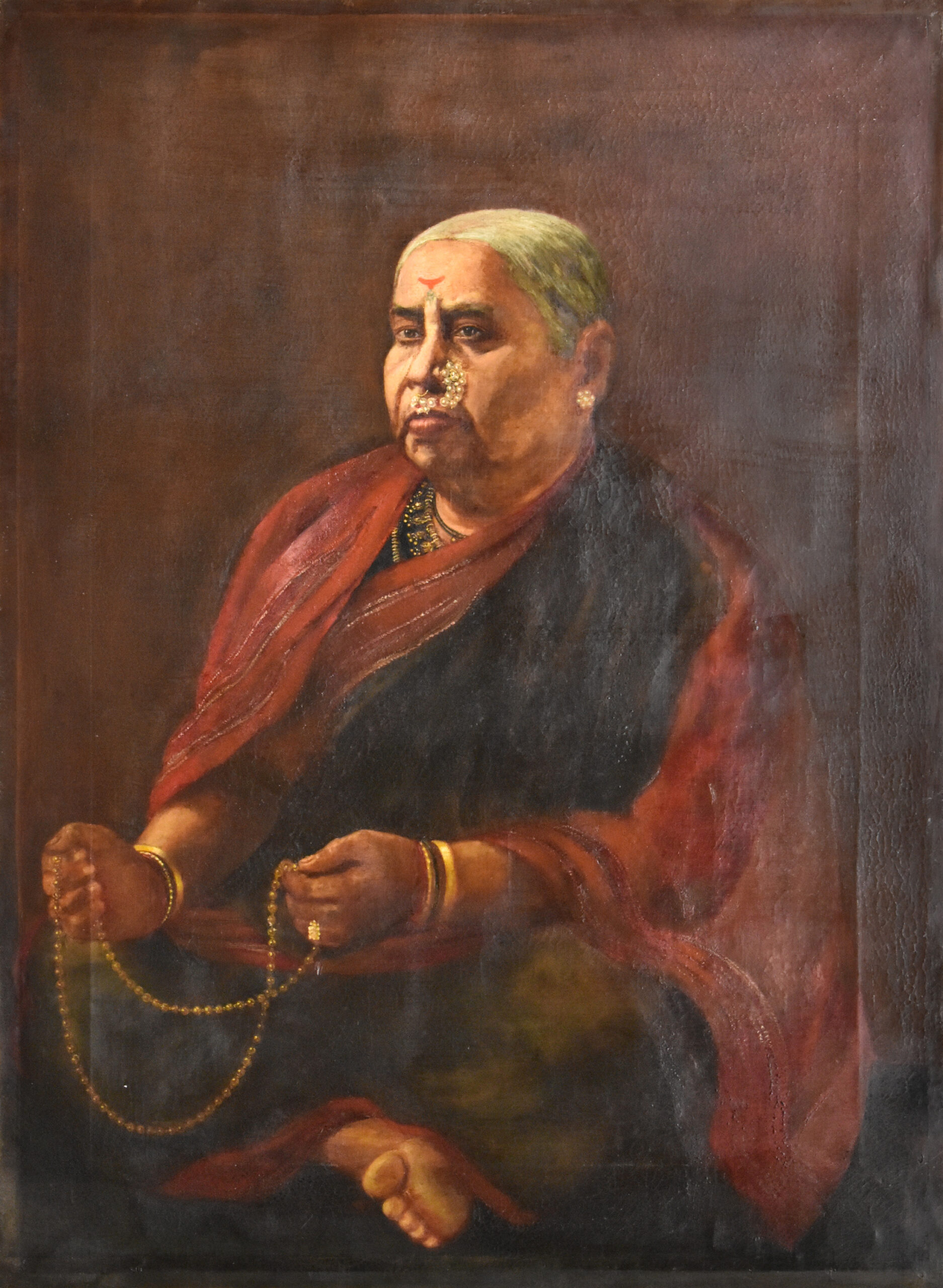 Elderly woman with prayer beads